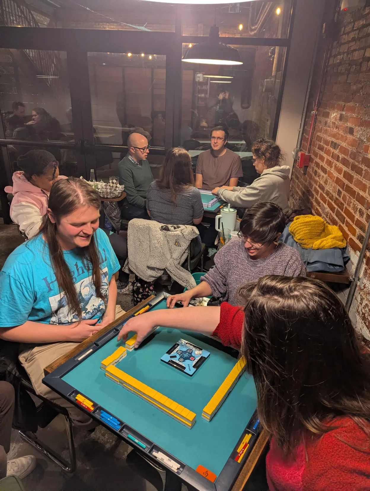 A packed evening of riichi mahjong at No Land Beyond with the Charm City Riichi club