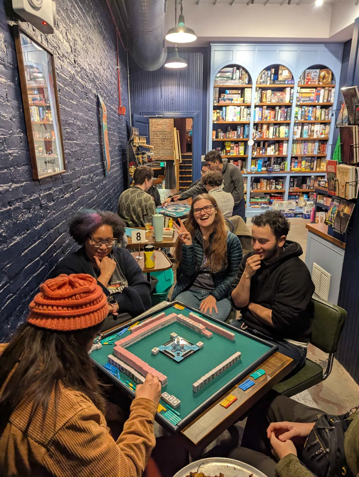 Happy Charm City Riichi members playing mahjong at No Land Beyond in Baltimore, MD